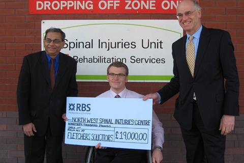 Legal eagles raise spinal cash