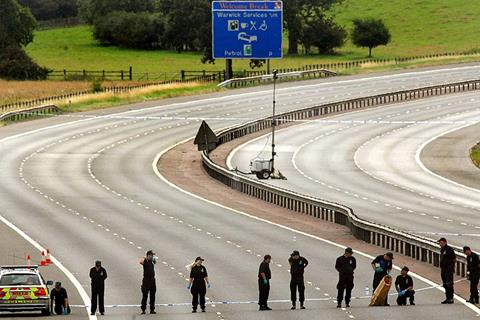 Police hunt green Rover in biker shooting