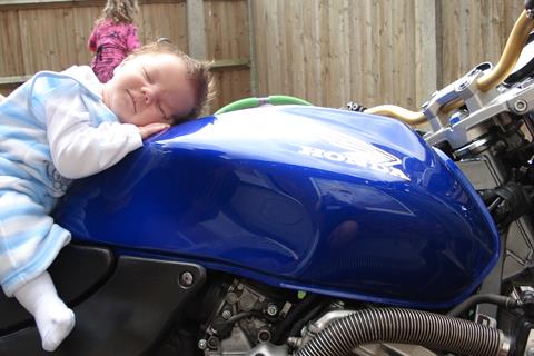 On daddy's bike