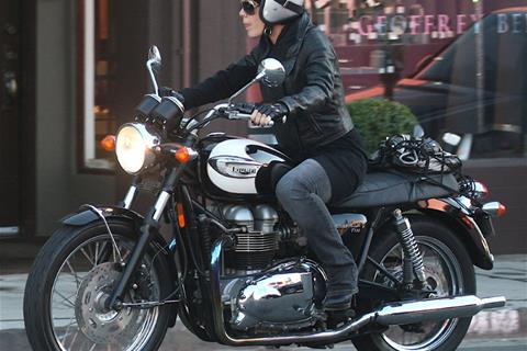 Pink spotted riding Triumph Bonneville