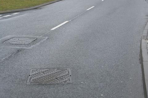 The road with 200 manhole covers per mile