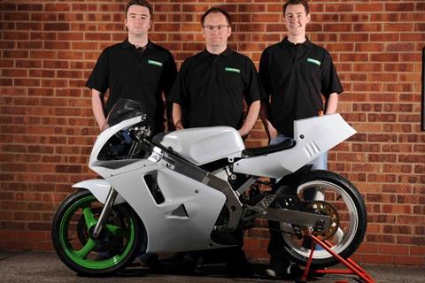 Three men in a garage build electric RGV250