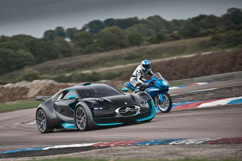 Electric car takes on electric bike at Thruxton