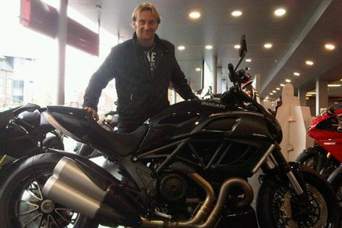 Carl Fogarty picks up a Ducati Diavel