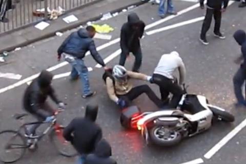 Rioters attack scooter rider