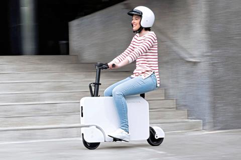 Ride it to the office then just fold it up: Honda Motocompacto can be stashed under your desk