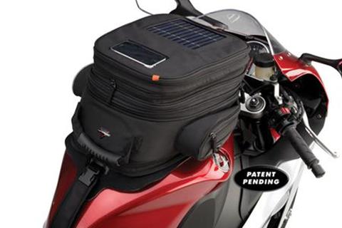 Solar powered tank bag on release