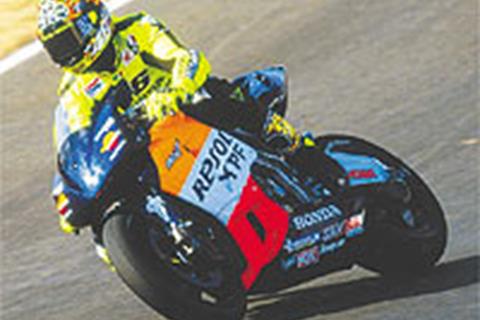 Rossi beats lap-record pace in first Aussie session