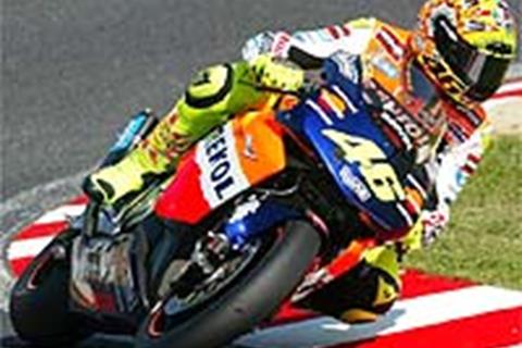 Capirossi crashes, Rossi goes quickest