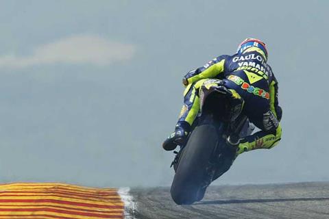 Rossi takes tough win