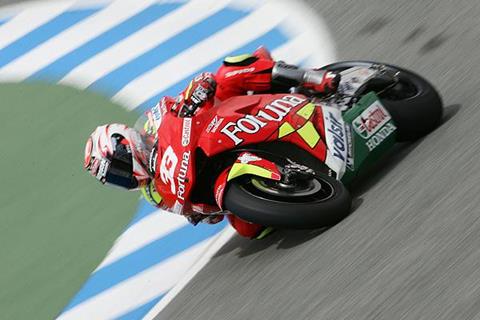 Capirossi takes pole