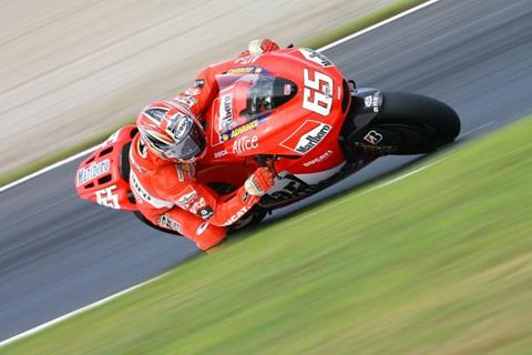 Capirossi takes pole