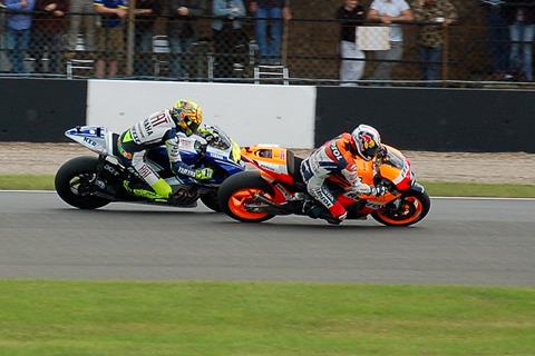 Dani Pedrosa passing Valentino Rossi