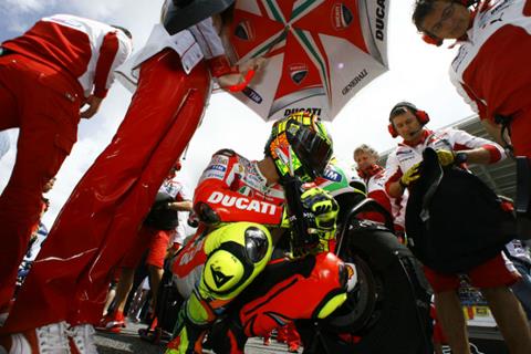 Valentino Rossi vows to race on until end of 2014