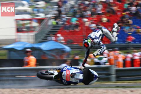 German MotoGP: Lorenzo crashes, bends plate in shoulder