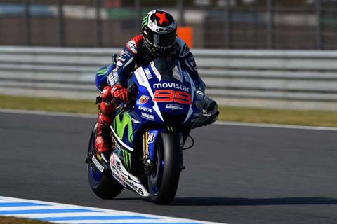 Thrilling battle sees Lorenzo take pole from Rossi 