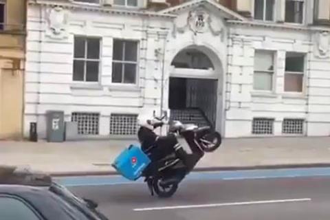 Video: Domino's Pizza delivery driver pops a wheelie on London road