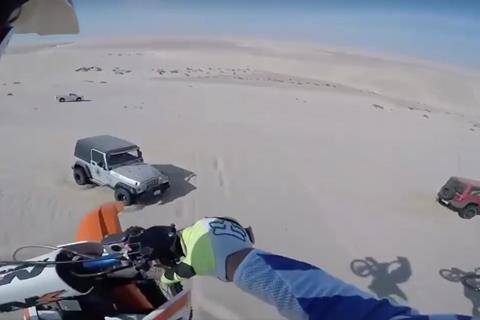 Video: Mid air surprise for dune riding motorcyclist