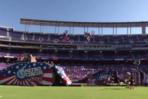 Nitro Circus stunt rider Travis Pastrana flips over Jay Leno's head