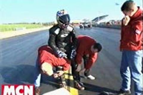 Three men to put him in his leathers